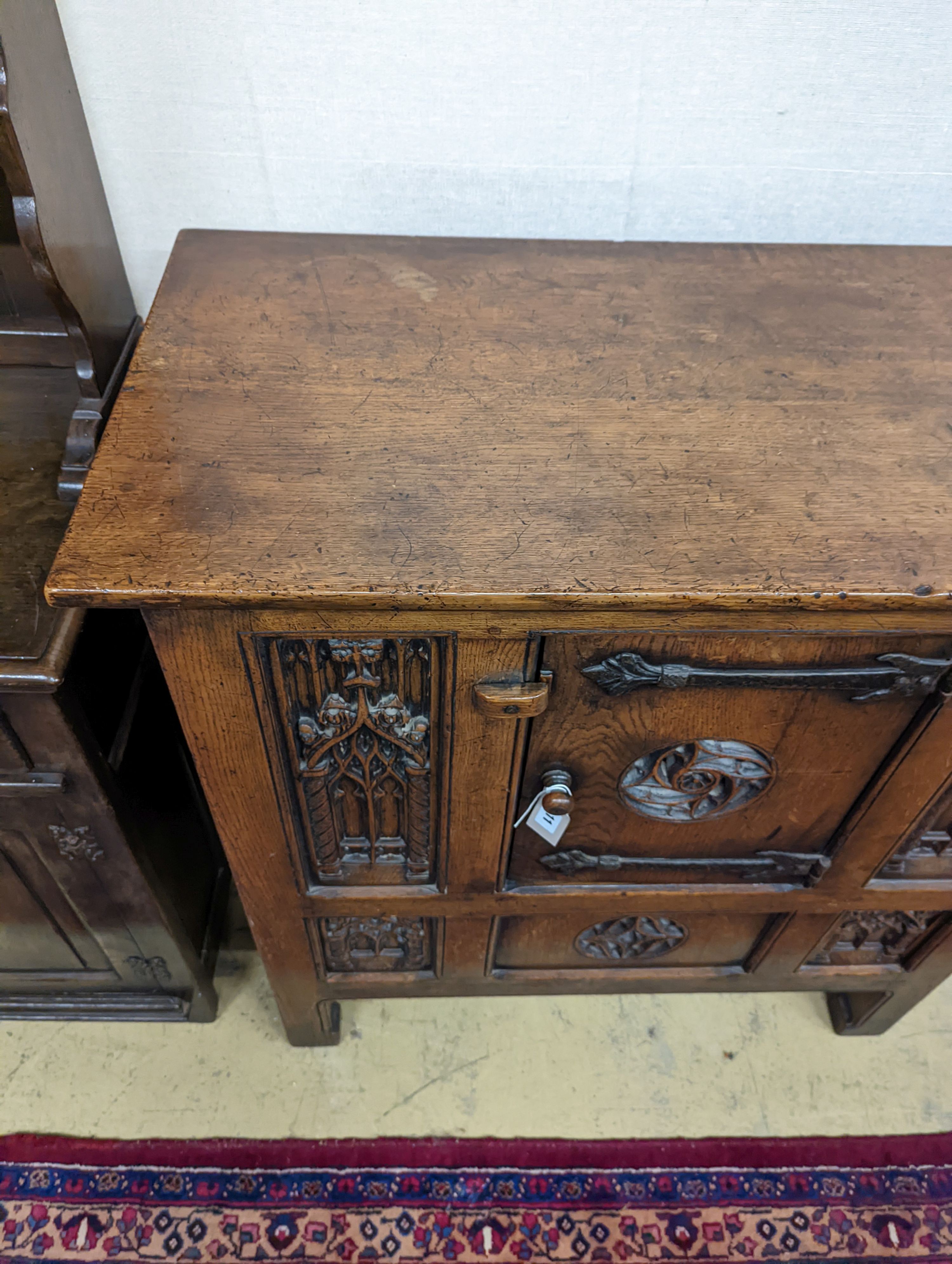 A Garrard Radiogram in a Gothic revival carved oak case. W-98cm,D-49cm, H-101cm.